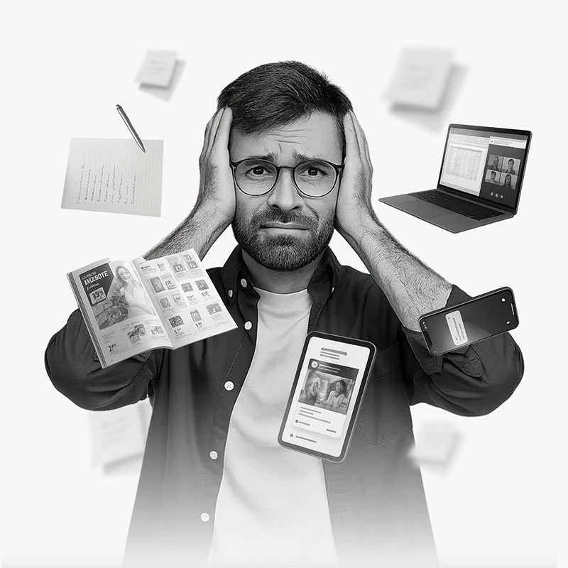 ems European Media Sourcing - Home - Mann umgeben von Telefon, Laptop, Haushaltswerbung, Zettel
